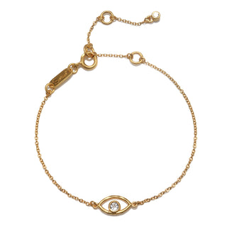Gold bracelet with evil eye and white topaz