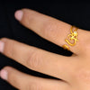 Satya Jewelry Ring Ring Goud met Witte Topaas - Om Symbool